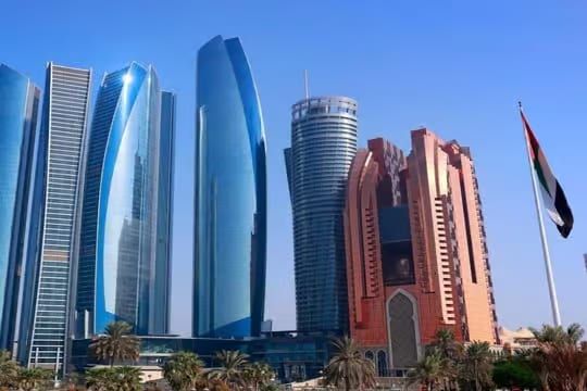 Glass towers of Abu Dhabi against a blue sky